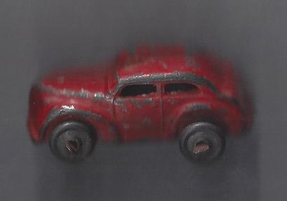 C. Early 1950's Small Toy 4 Door Metal Sedan 